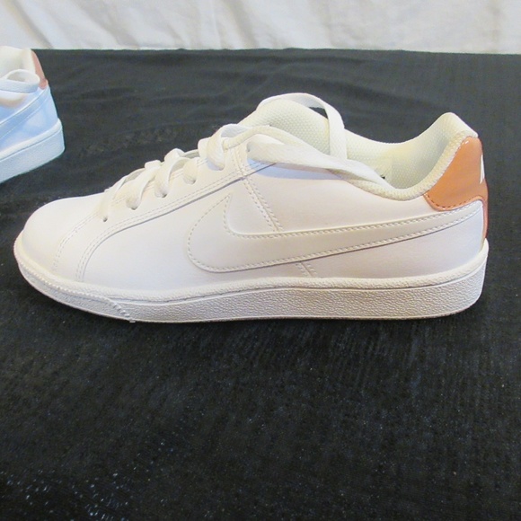 white and peach nike shoes